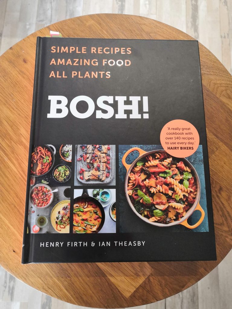 Bosh vegan cookbook on a stool