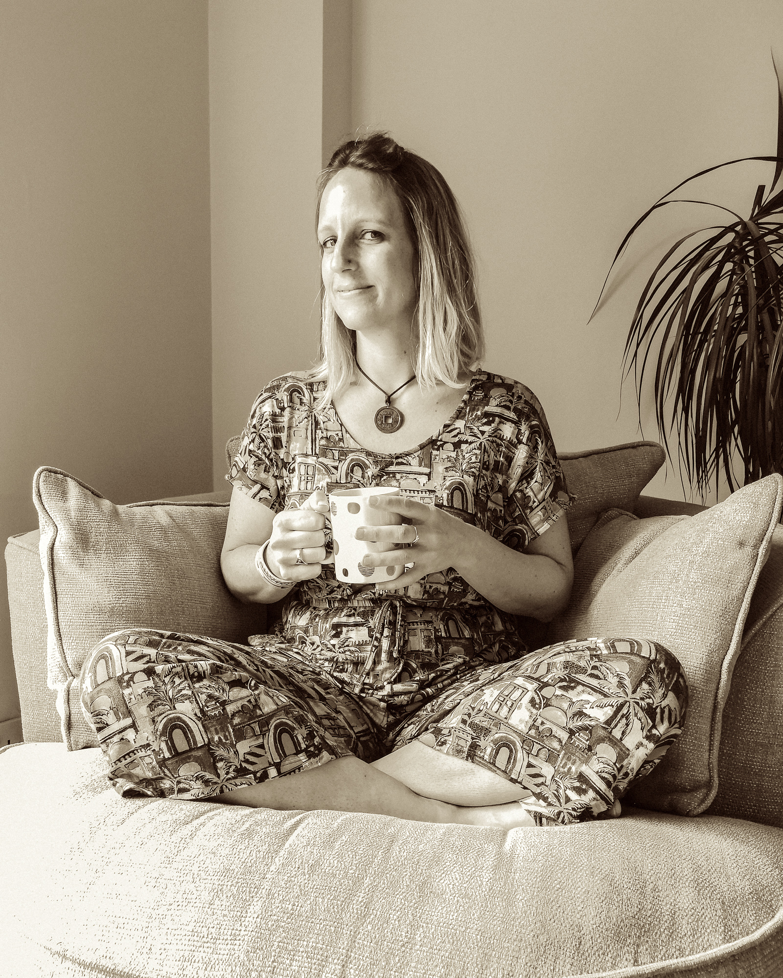 Martina Jay sitting with cup of tea