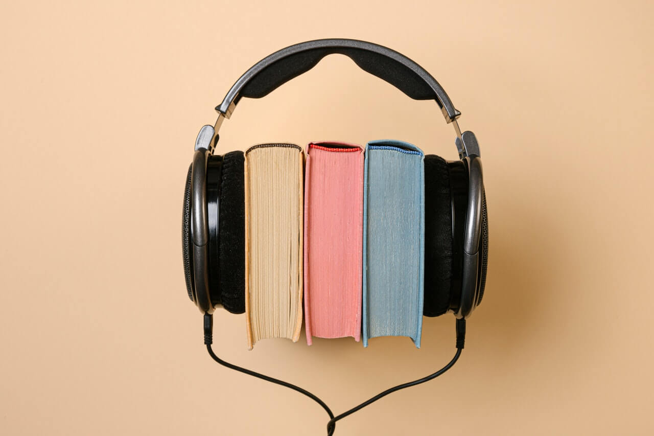 books with headphones representing audio books