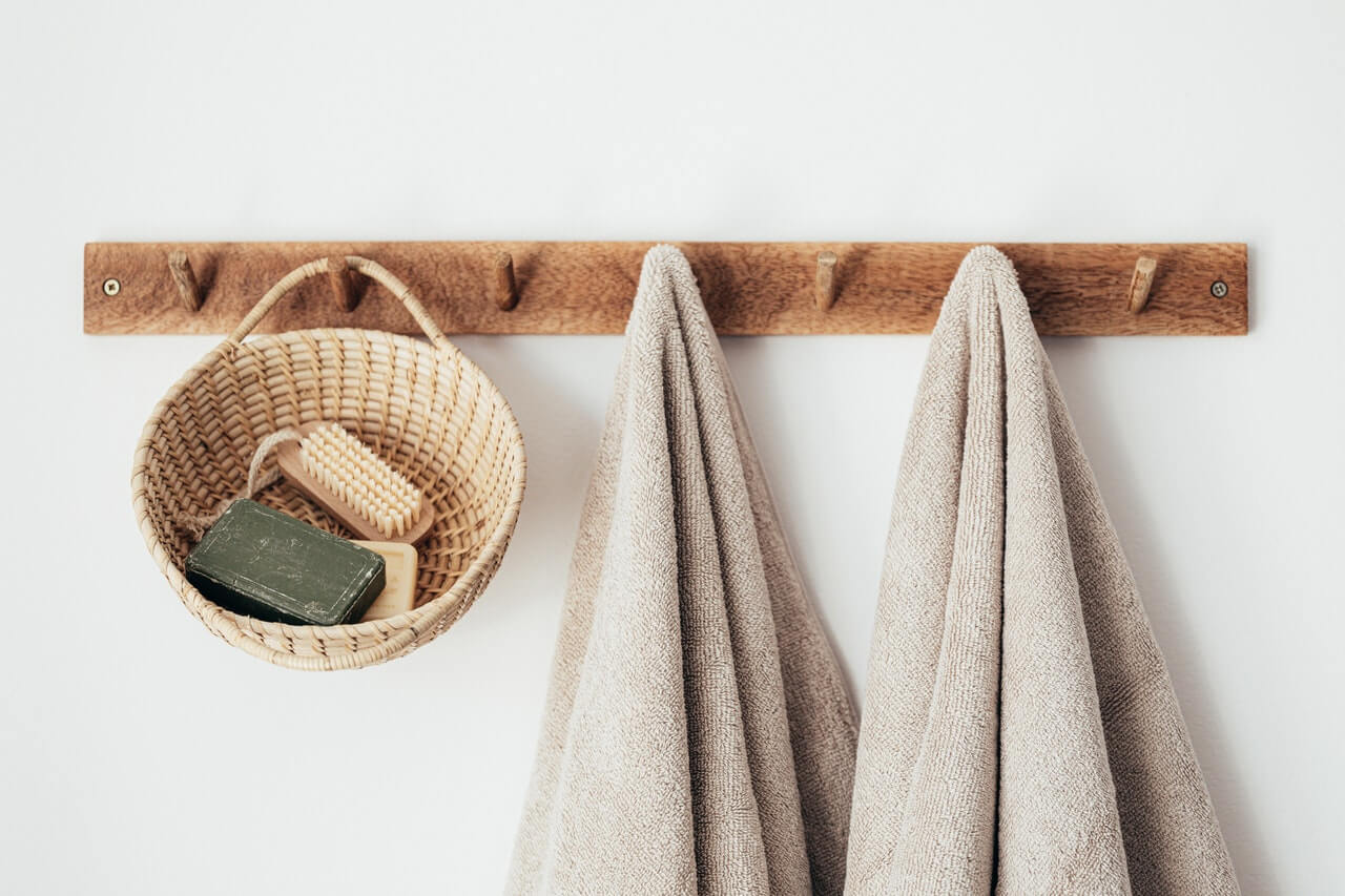 Wall hooks and basket that organise clutter